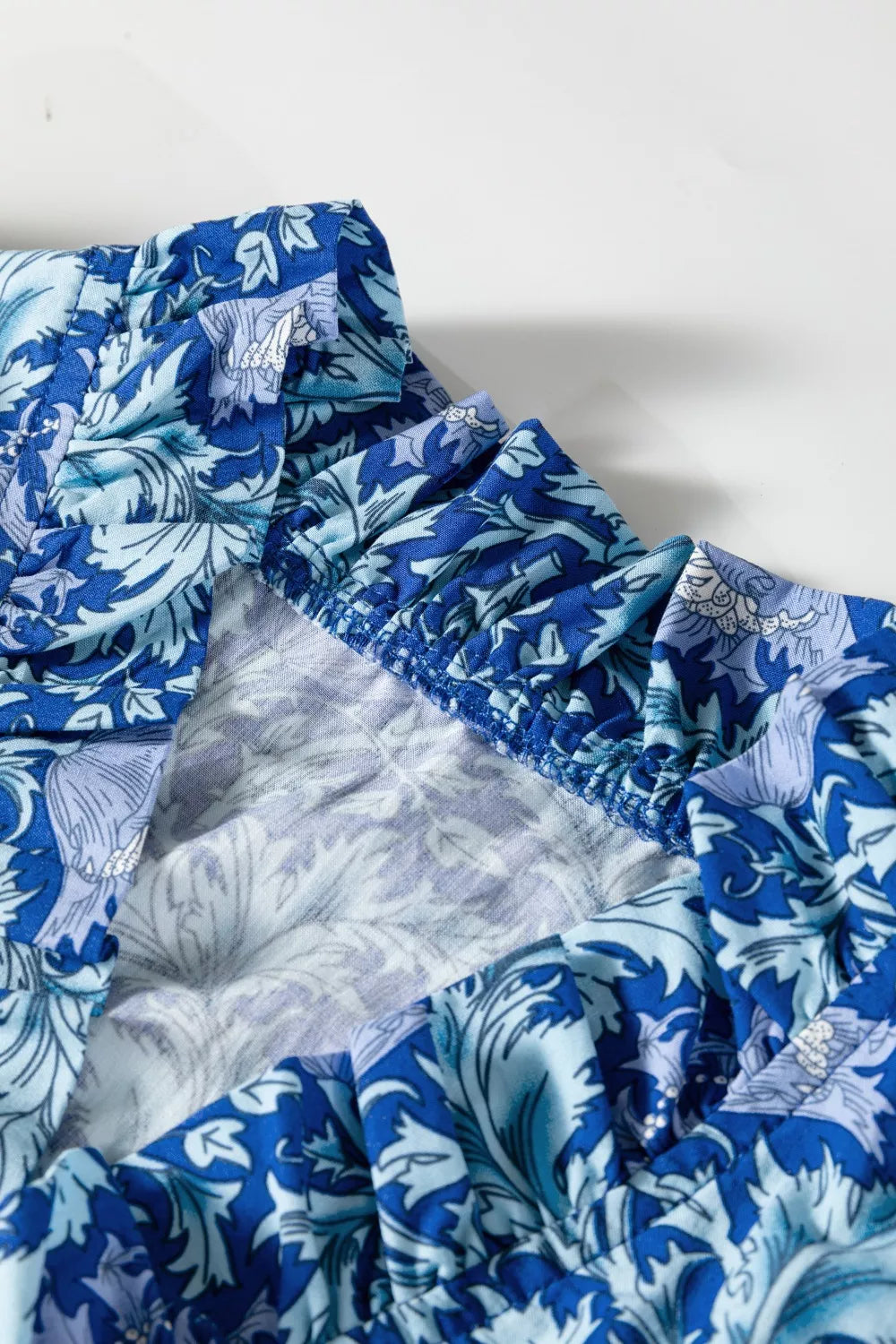 Dusty blue floral V neck tiered maxi dress front view