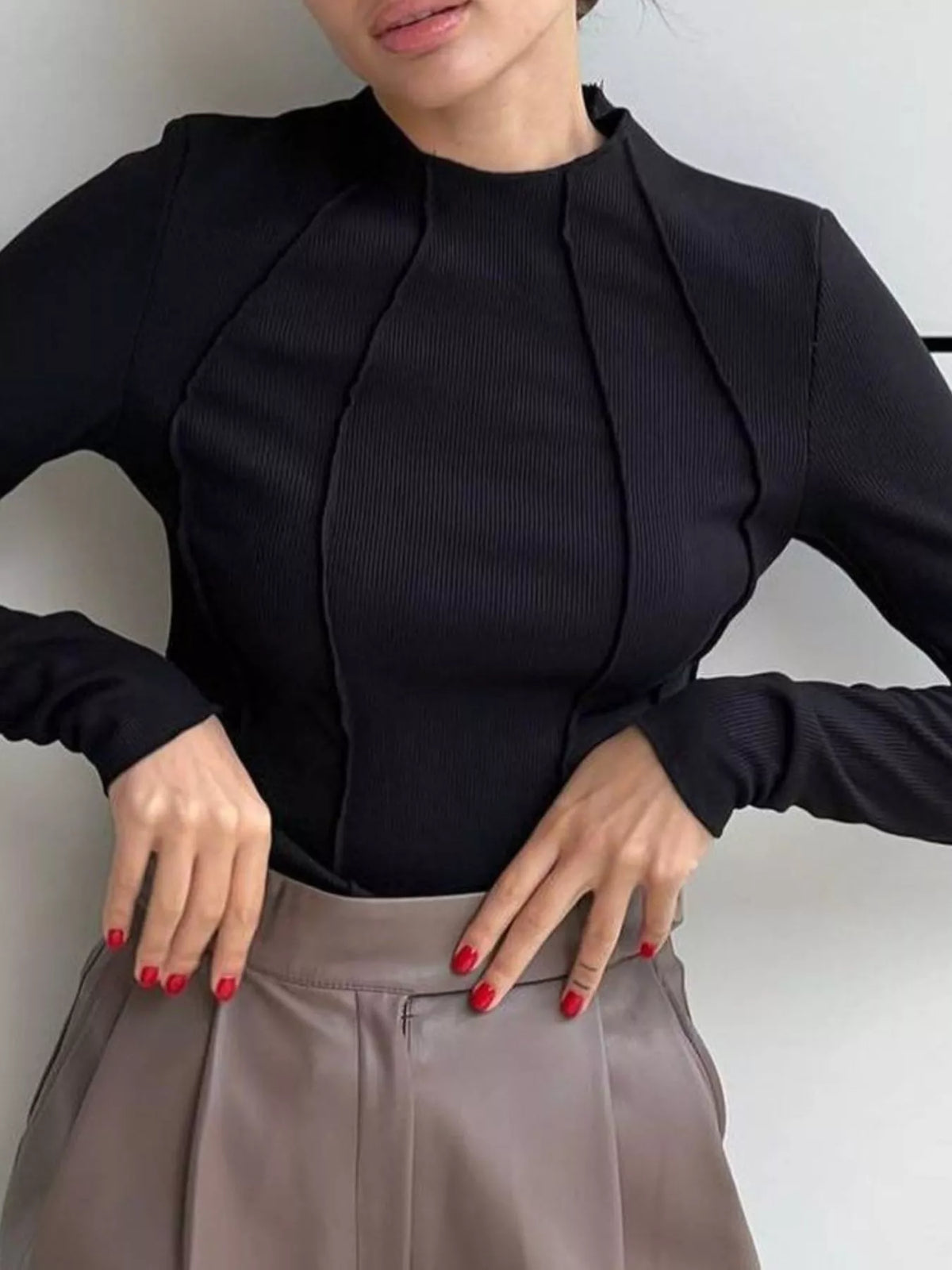 Side view of fitted long sleeve tee showing hem length