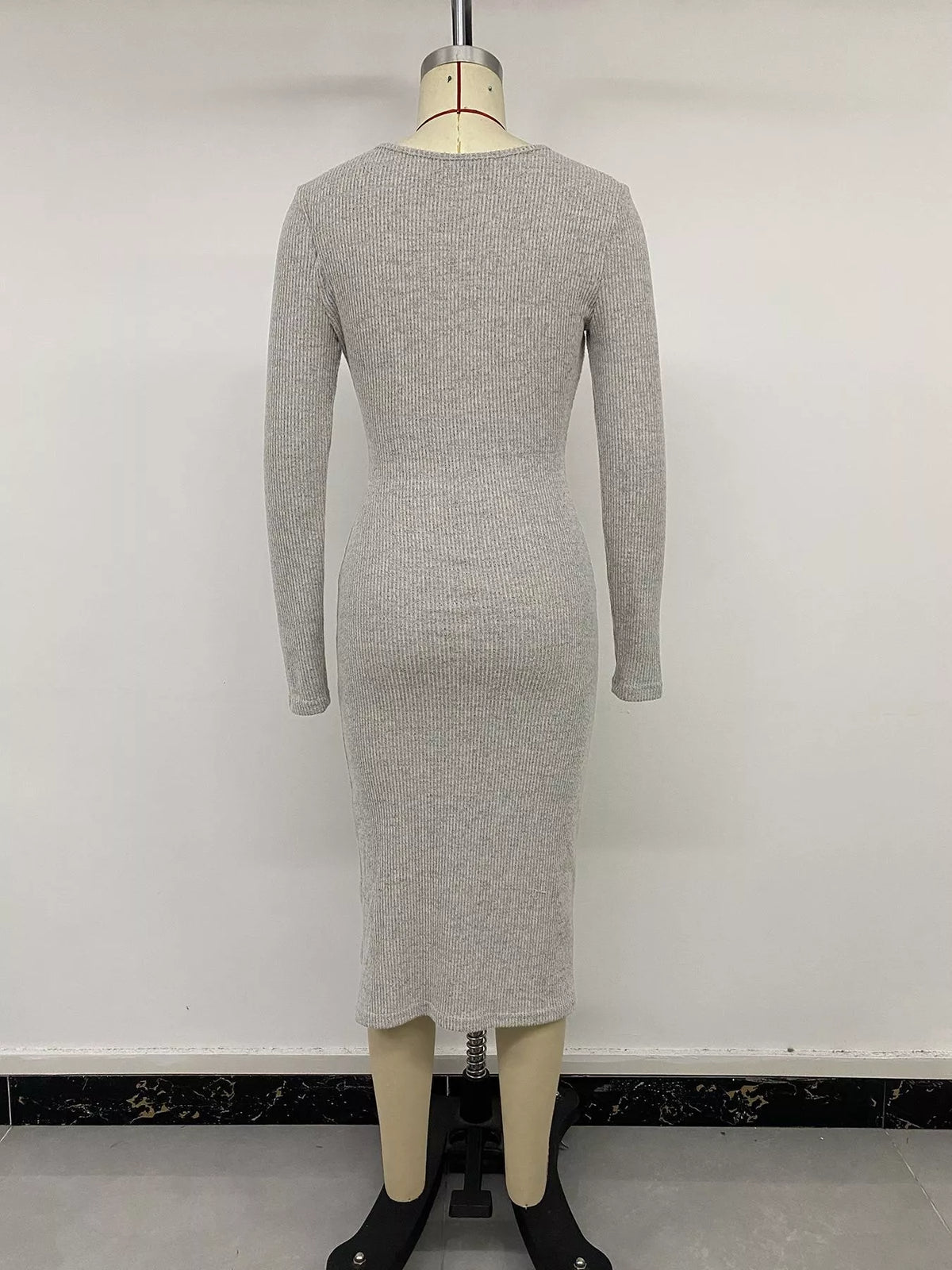 Three quarter view of the twist front knit dress