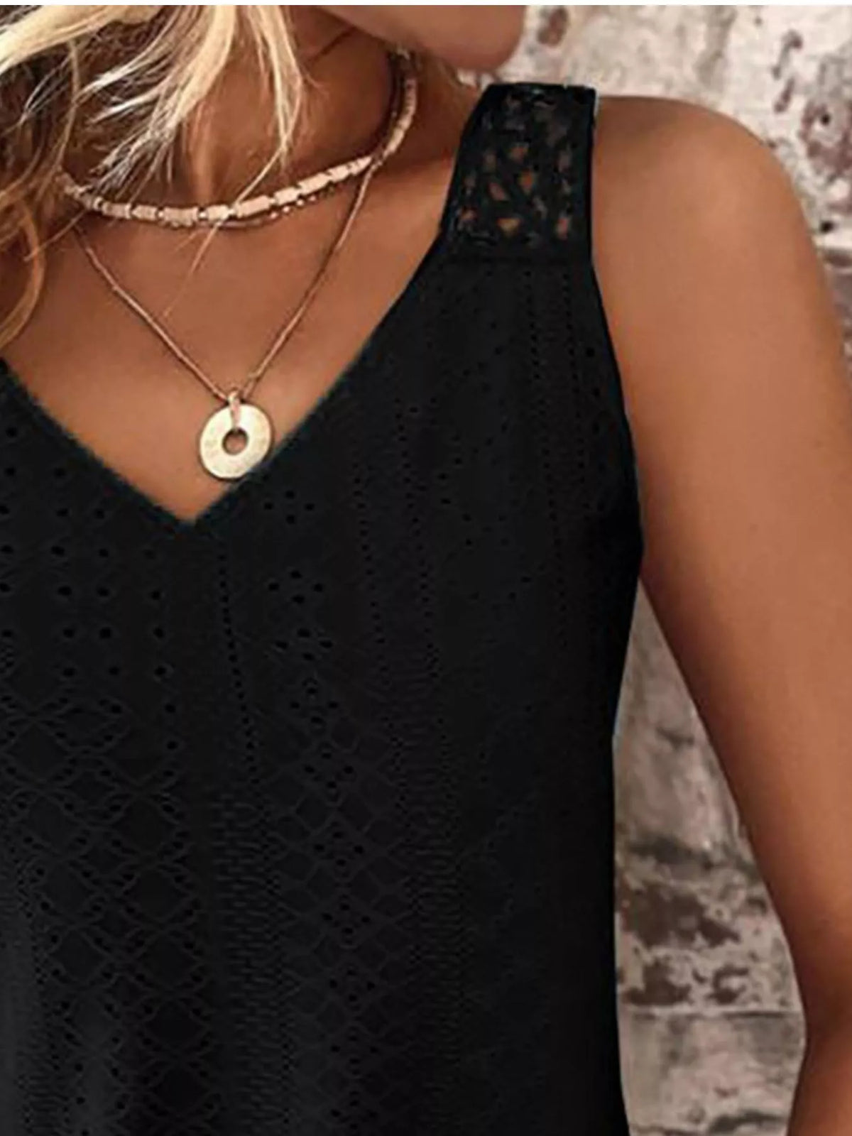 Close up of the eyelet trim along the V neckline