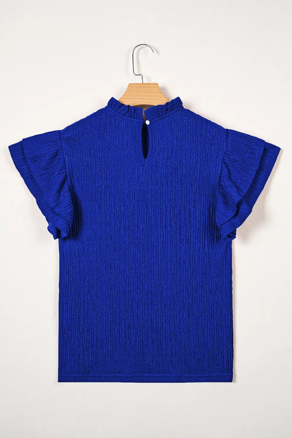 Navy textured ruffle trim short sleeve blouse detail view
