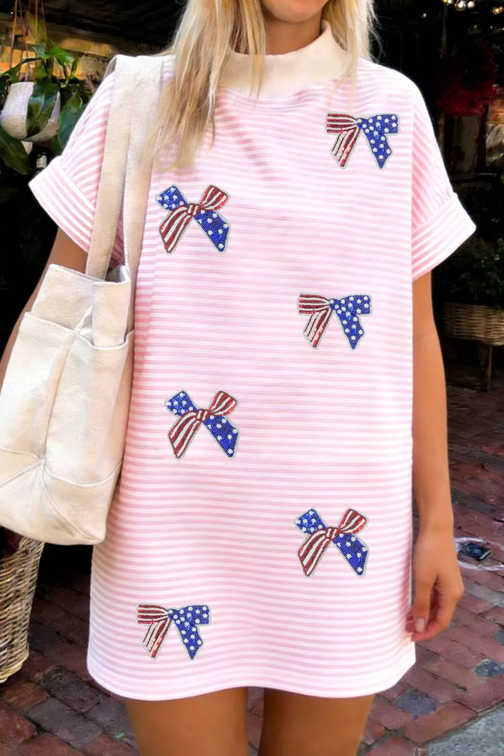 Blush pink striped bow sequin mini dress front view