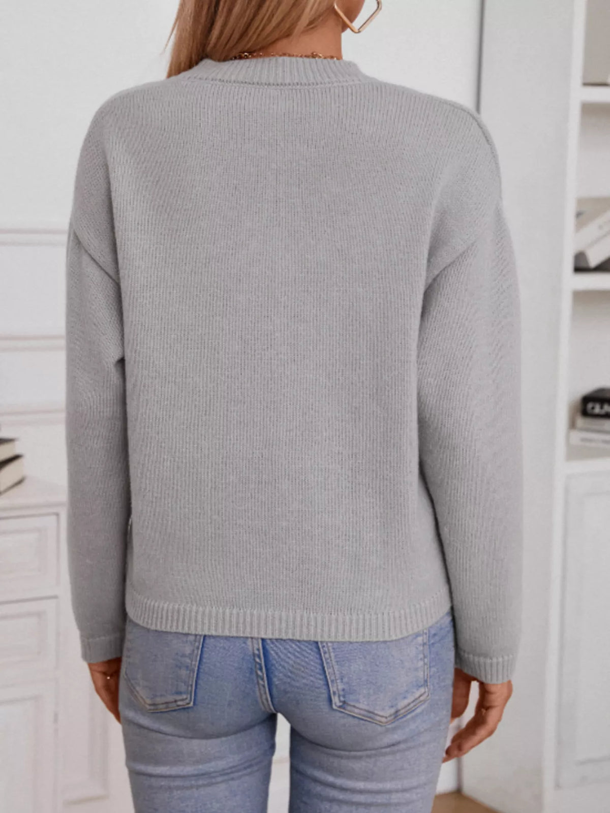 Grey notched dropped shoulder sweater three quarter view