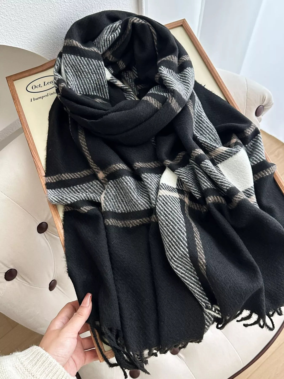 Violet plaid scarf styled around the neck