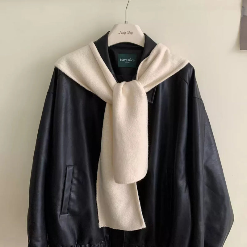 Knitted hooded scarf shown with the hood up