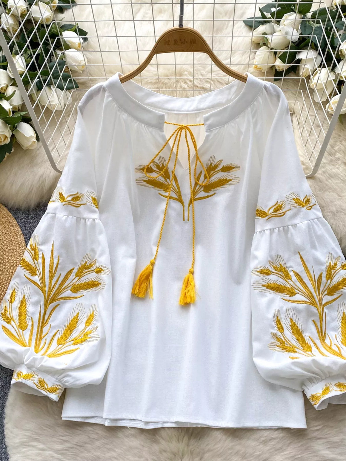 embroidered wheat pattern tie neck blouse fabric detail