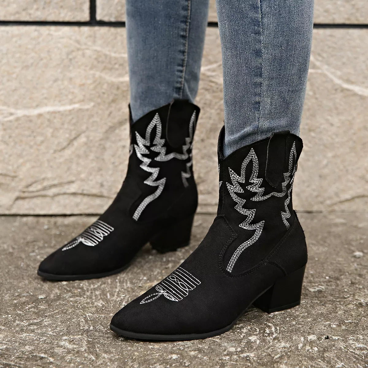 Point toe block heels boots styled with denim