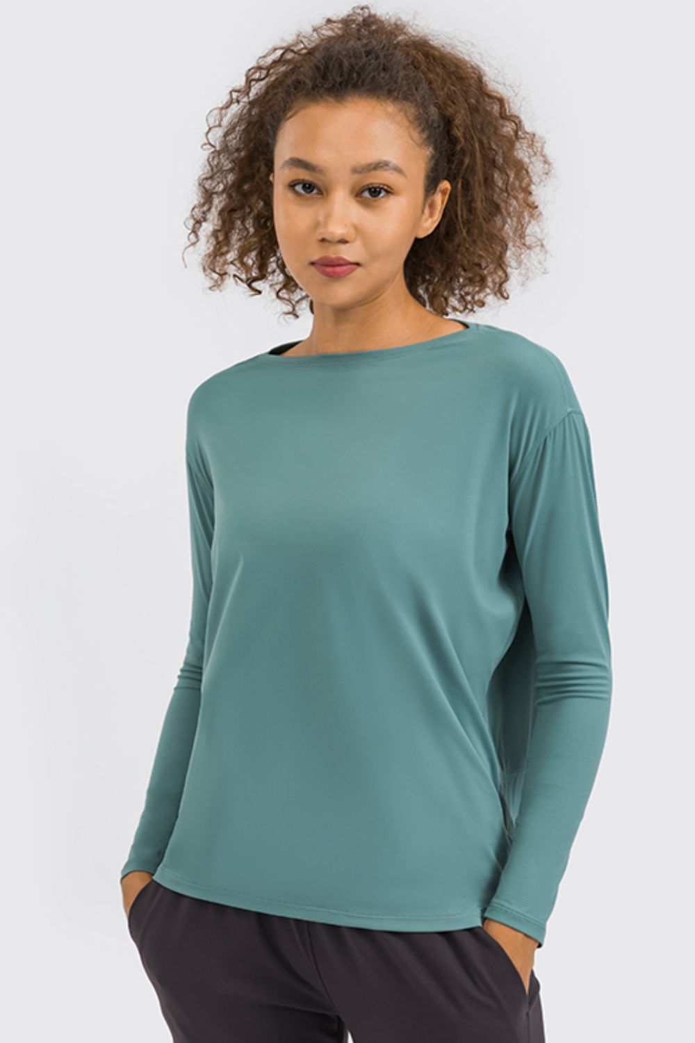 Loose fit active pullover top side view
