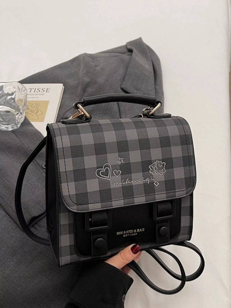 Black plaid embroidered flap mini backpack front view