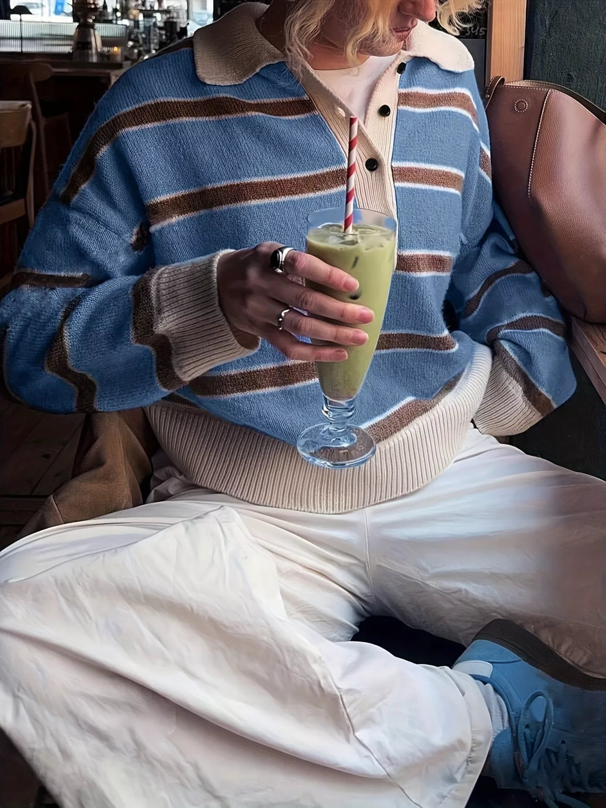 Model wearing blue striped button sweater