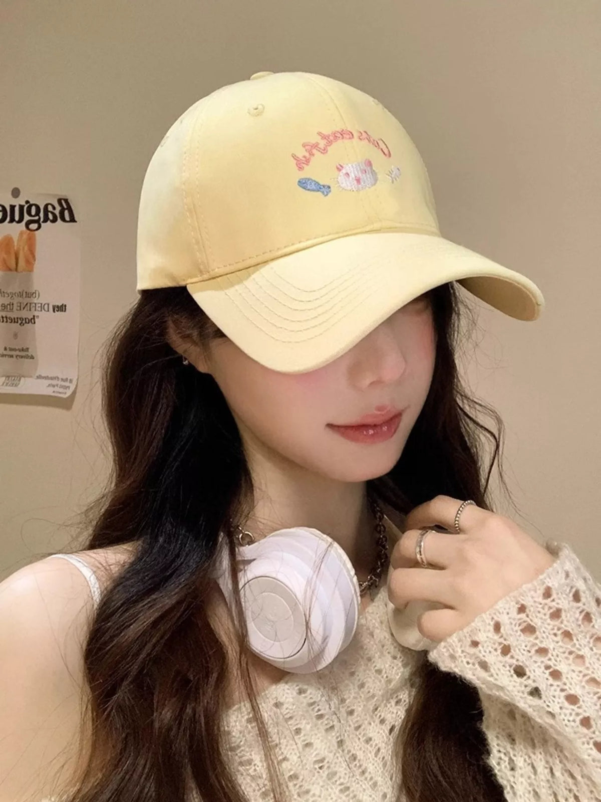 Cat embroidery detail on the cotton baseball cap