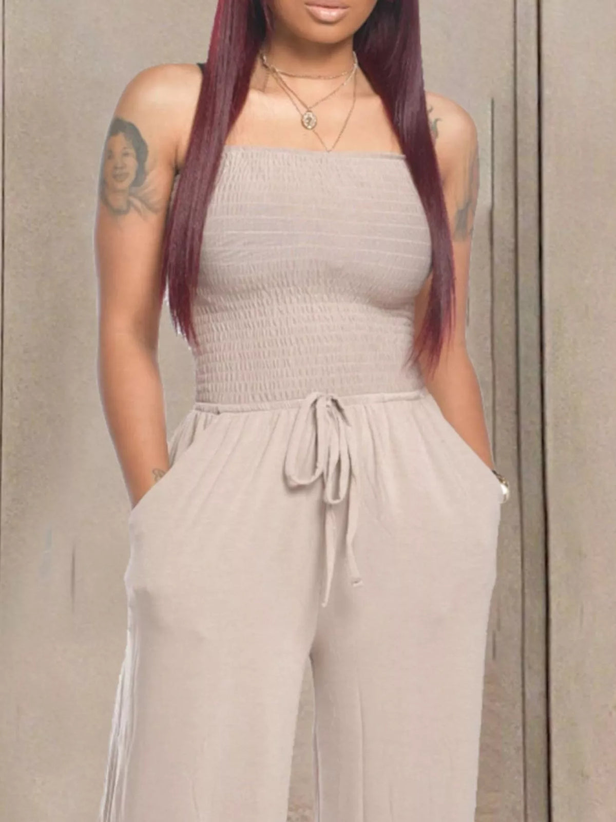 Strapless smocked wide leg jumpsuit hem detail