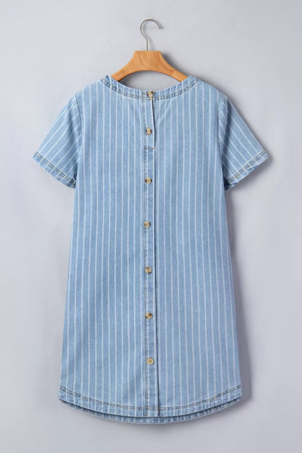 Light blue striped button back denim mini dress, full length view