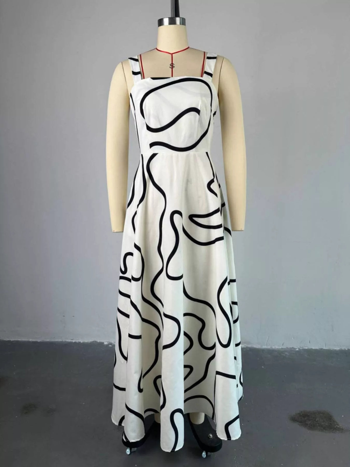 Side view showing the soft drape of the long printed skirt