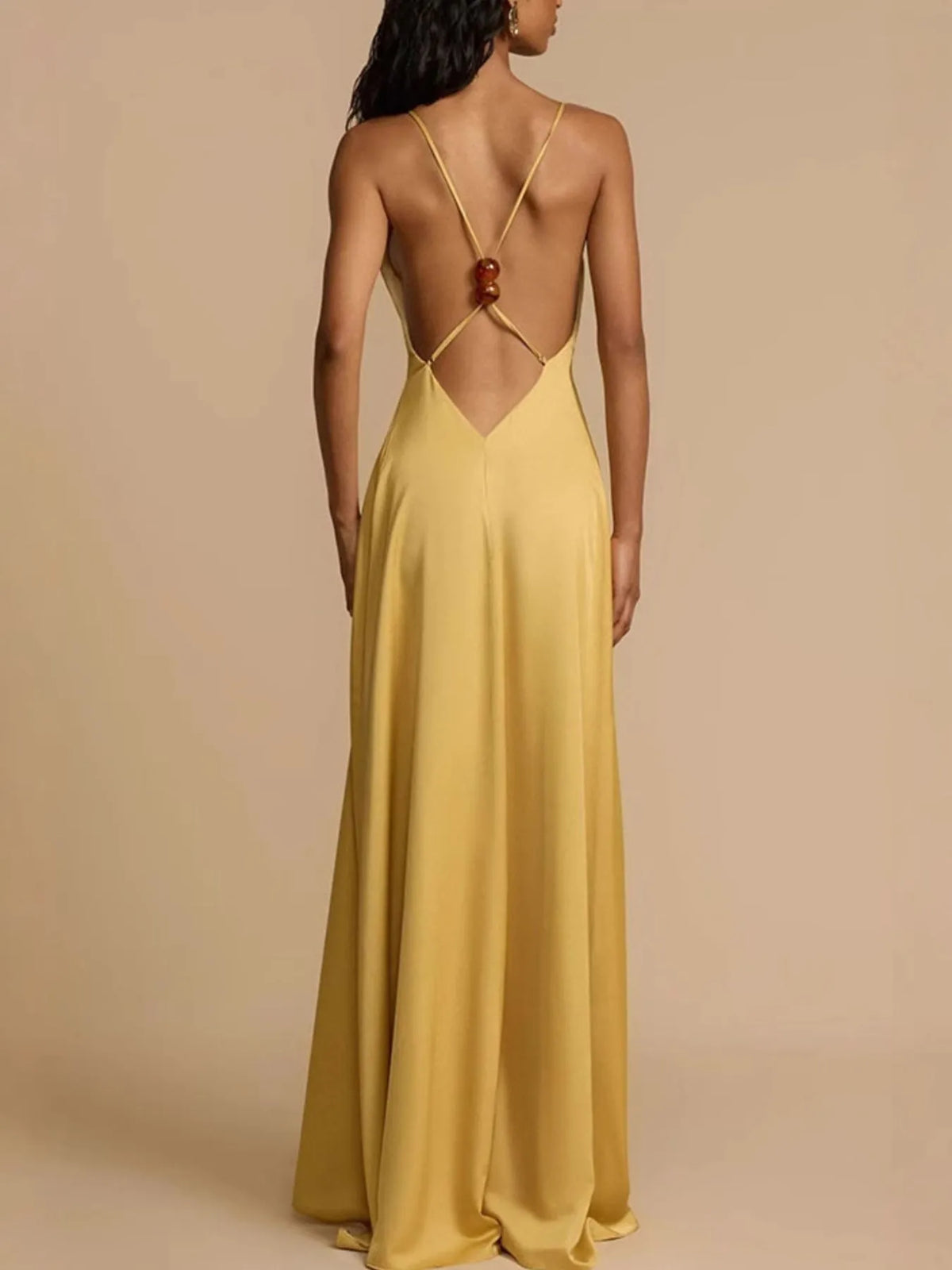 Deep V neck gold maxi dress styled detail