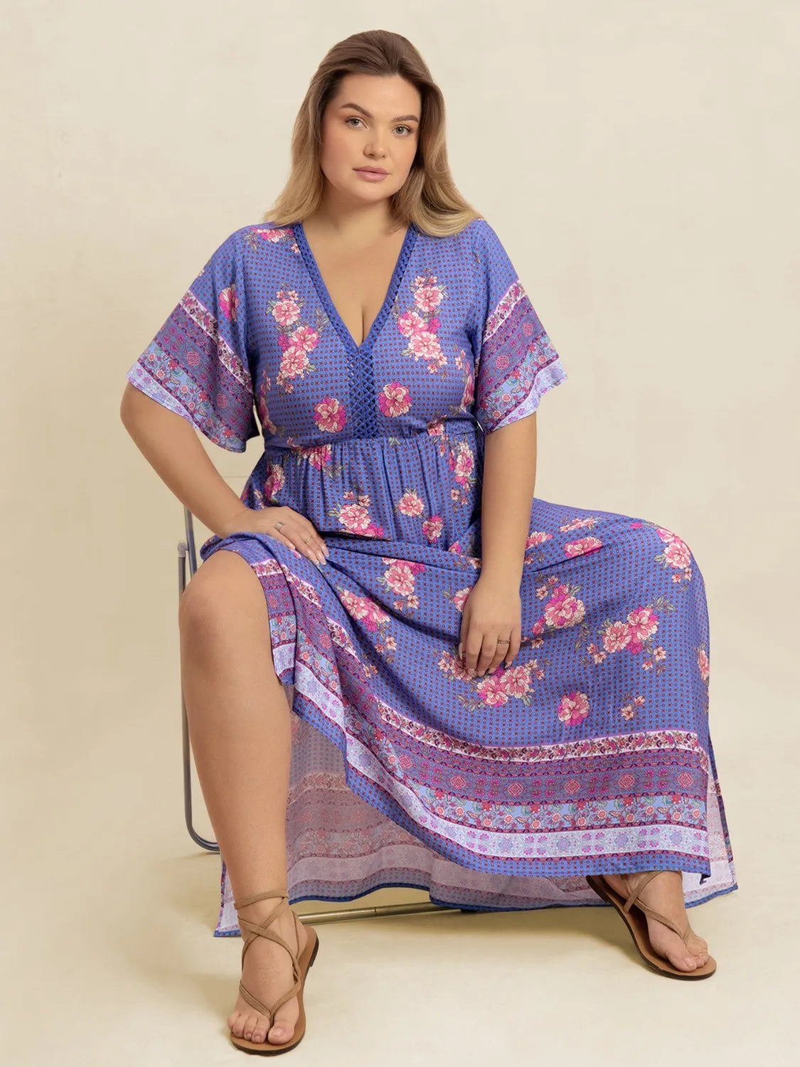blue purple plus size printed v neck flutter sleeve dress on model