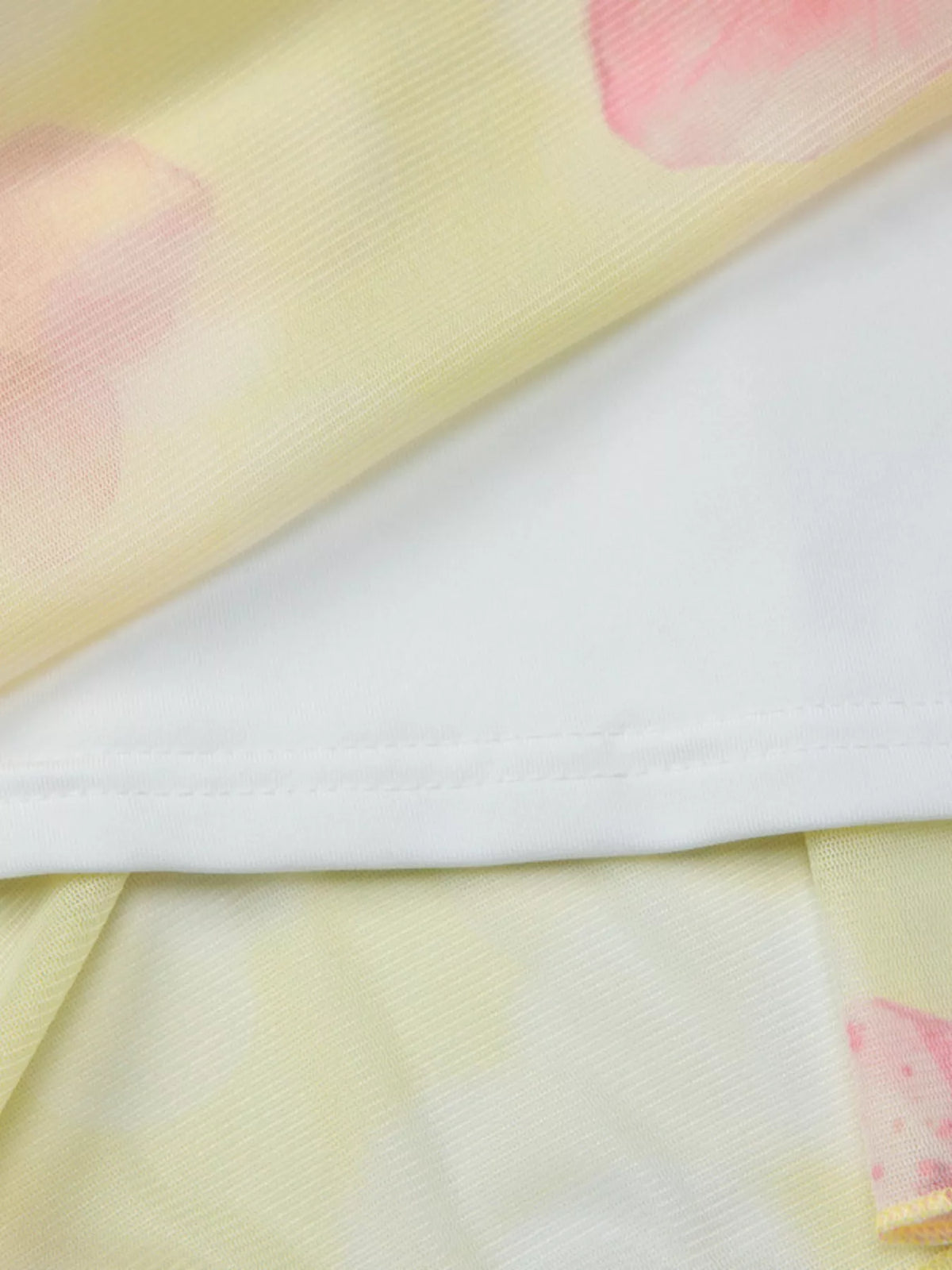 Ruffle hem detail on the sheer floral mini dress