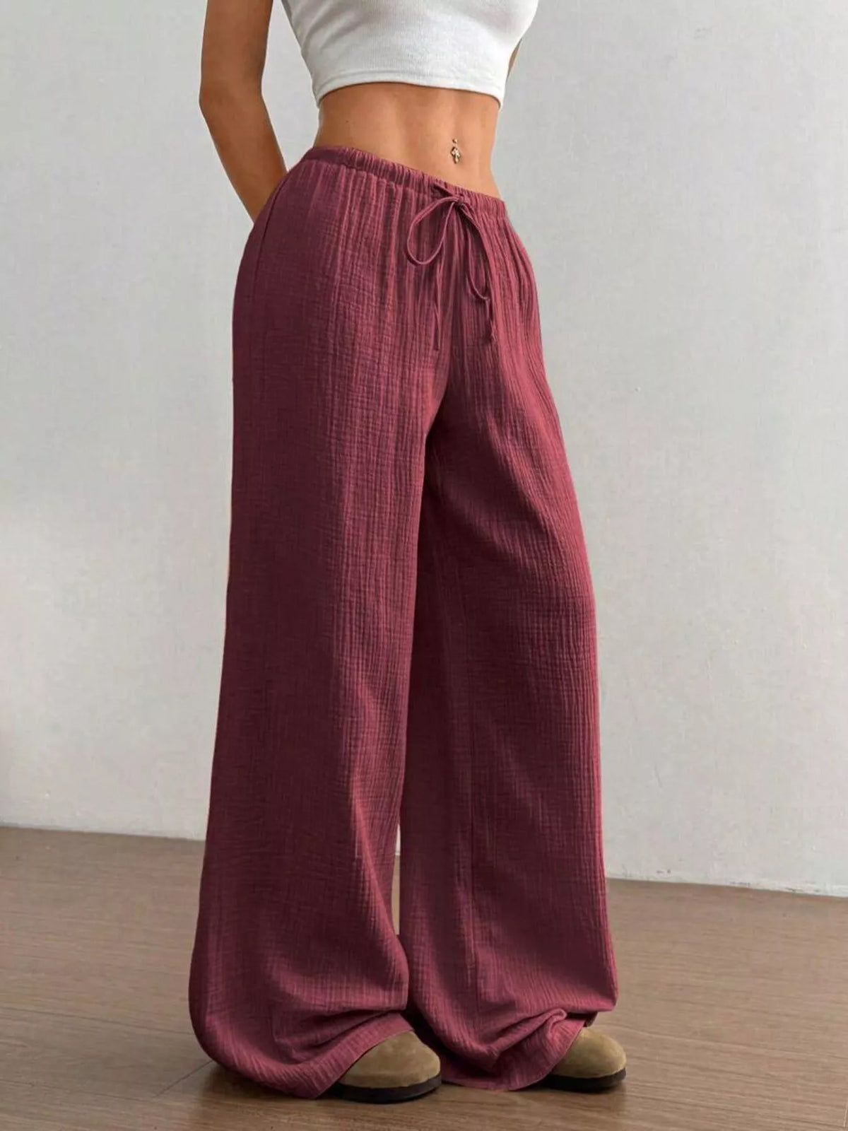 Drawstring pants seen at a three quarter angle