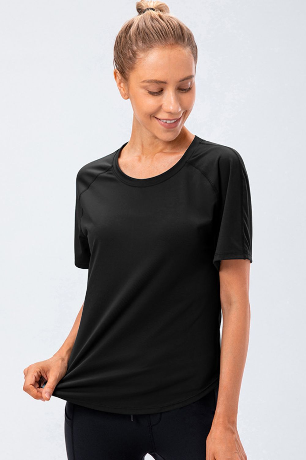 round neck raglan sleeve active tee styled on model