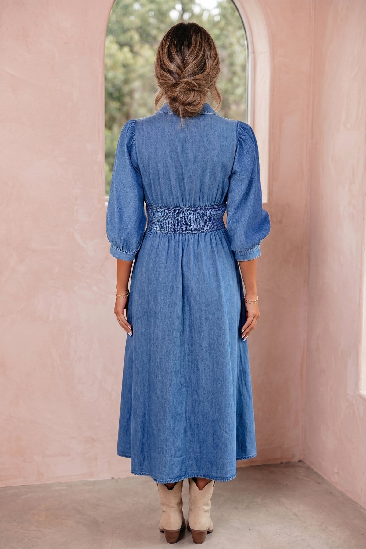 Blue denim midi dress showing shirred waist and puff sleeves