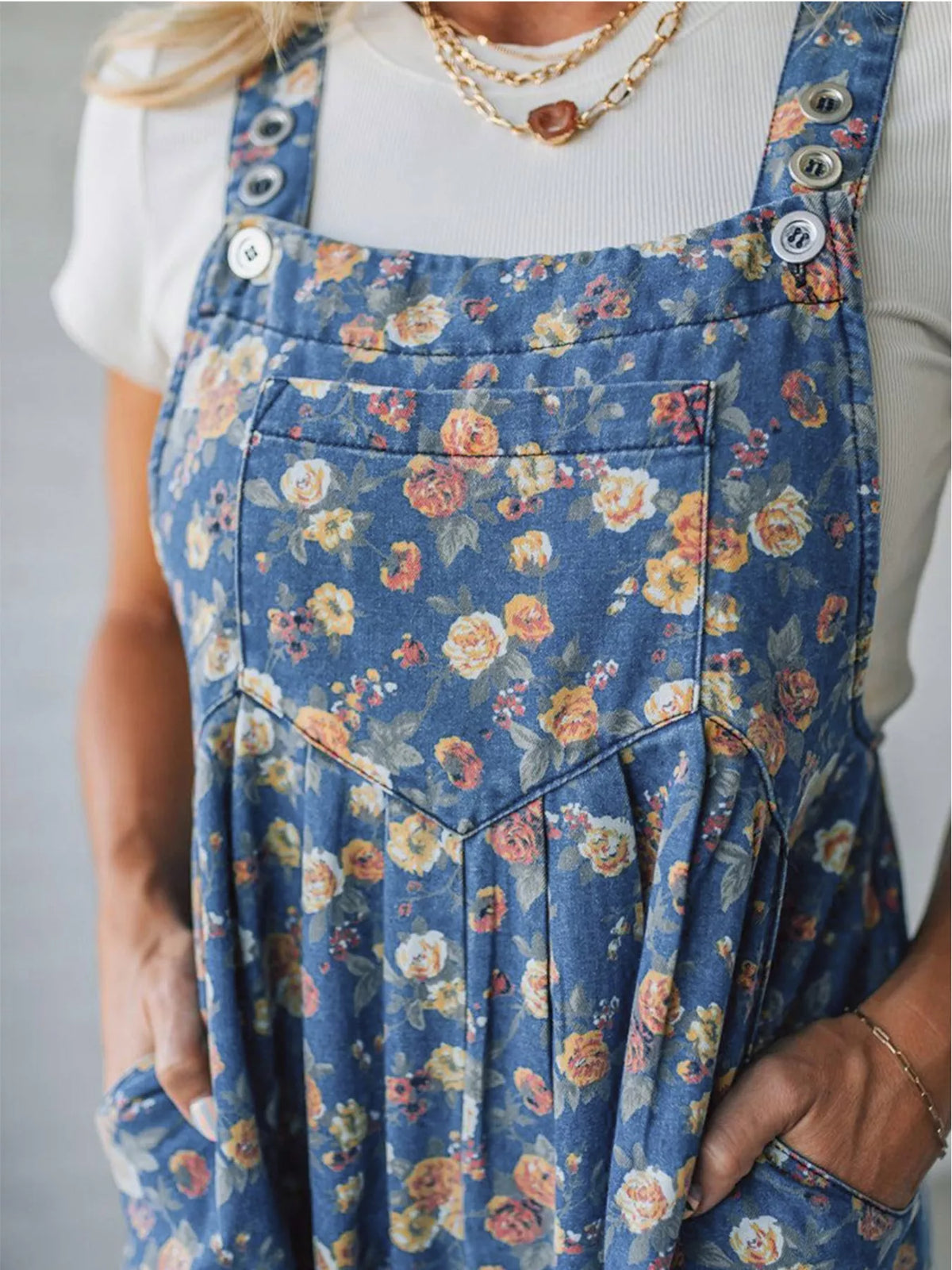 Floral overalls adjustable strap close up