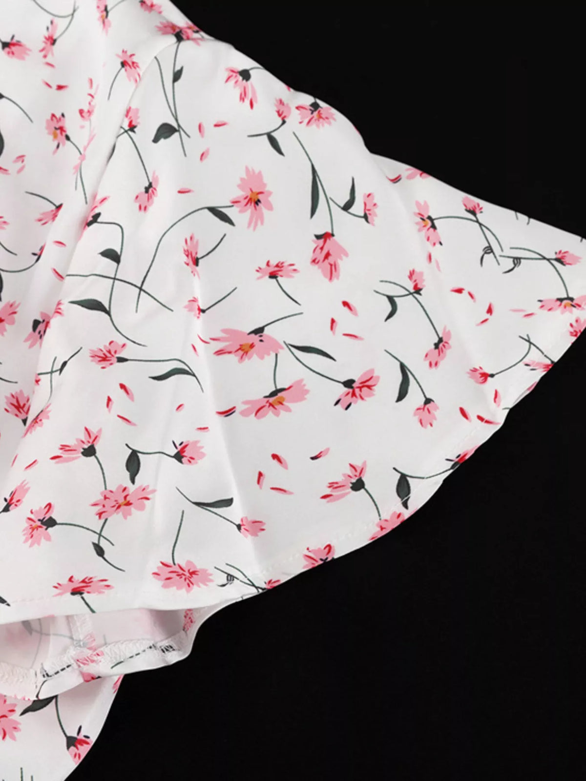 Button placket detail on a dusty pink floral dress