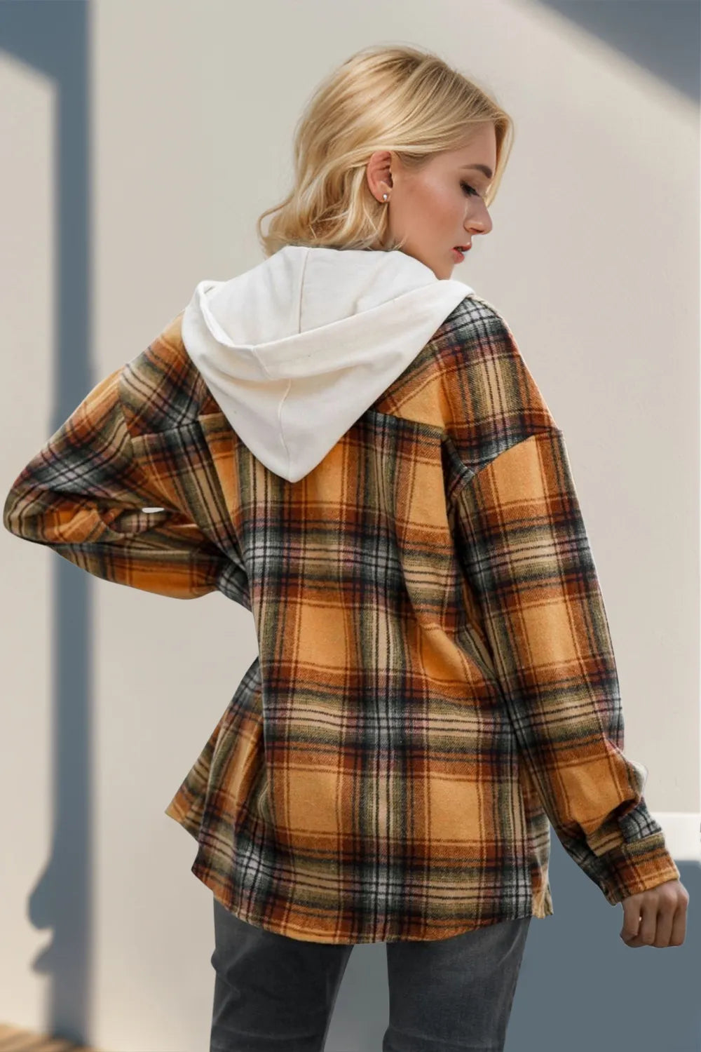 Hooded plaid shacket showing drawstring waist