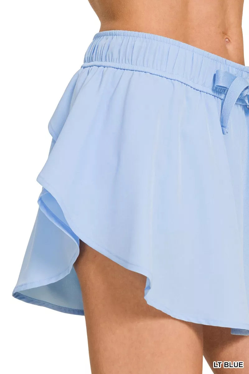 Zenana soft woven active skort with pockets in light blue fabric detail