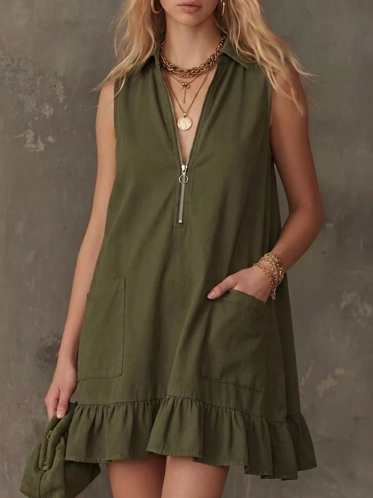 Sleeveless collared zip front ruffle hem dress front view