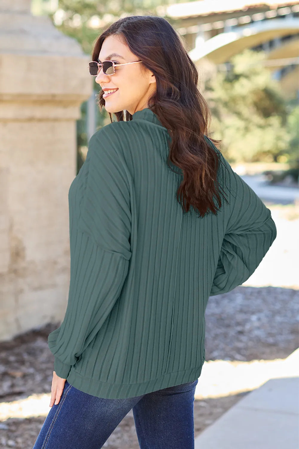 Mock neck knit top side view showing ribbed texture