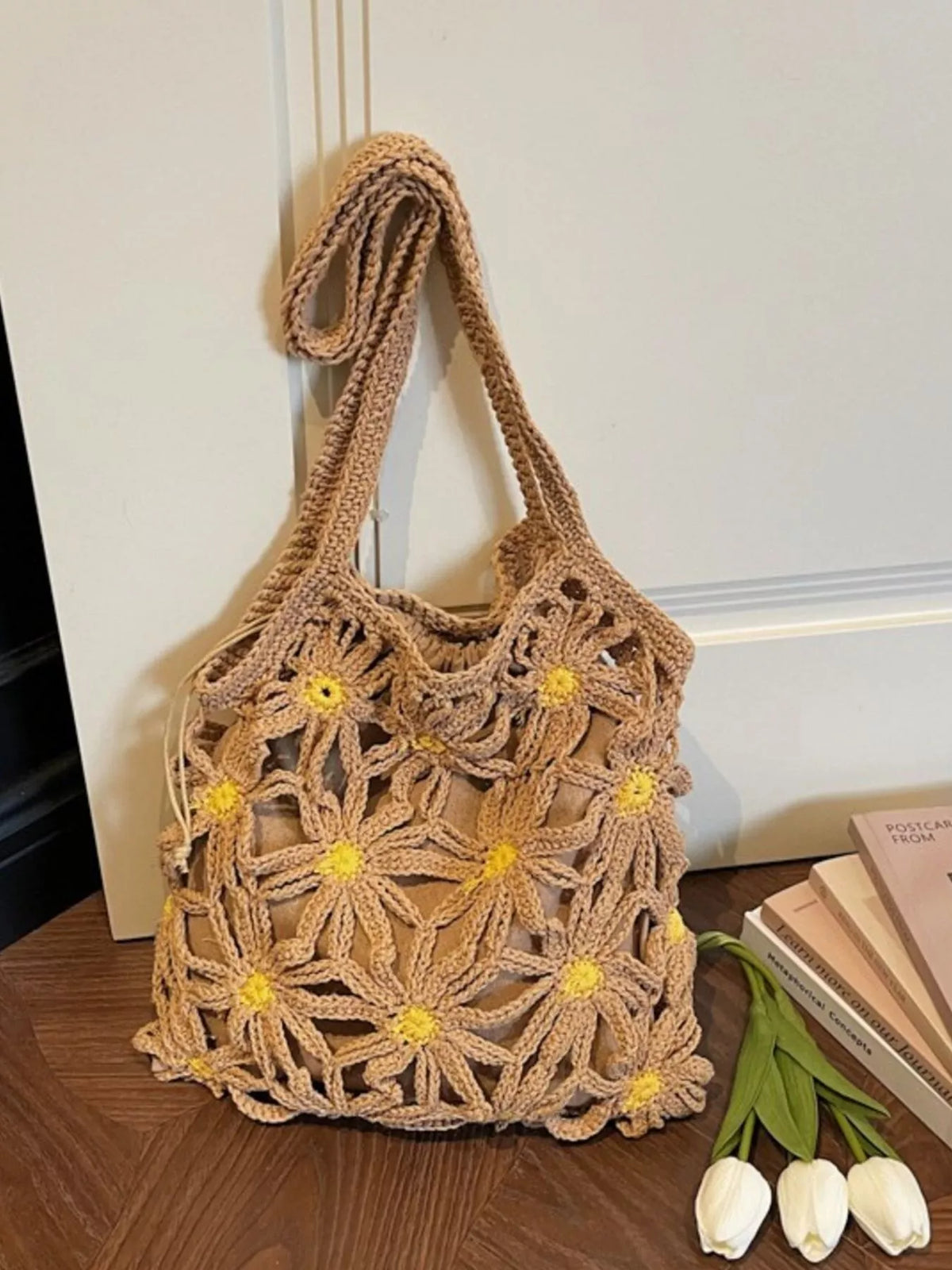 Crochet daisy motif detail on khaki bag