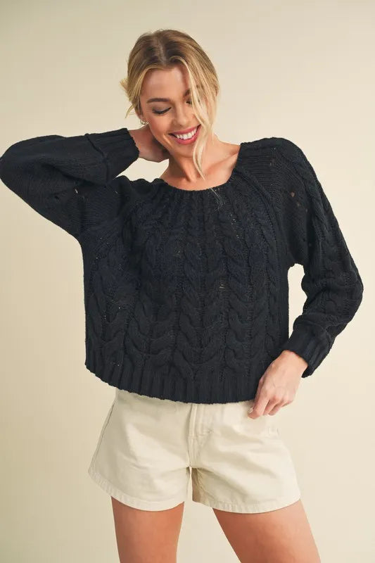 Black cable knit openwork round neck sweater front view