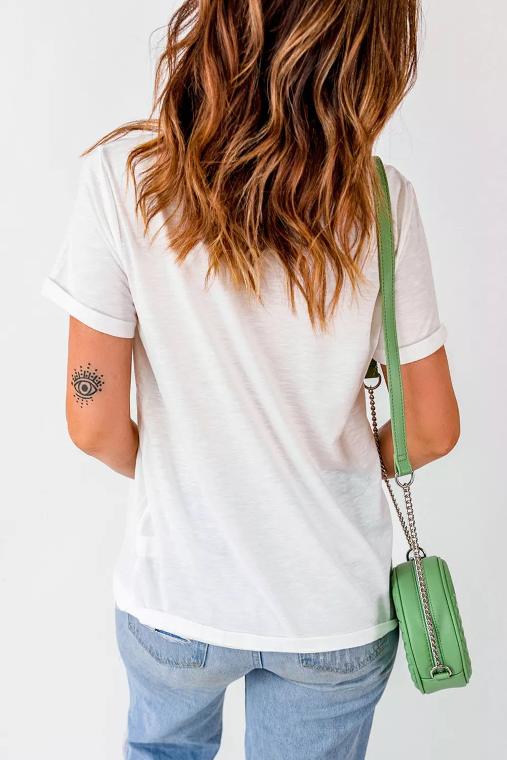 Side view of the white western graphic t shirt