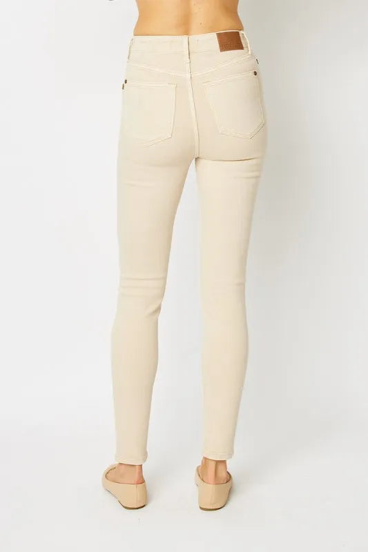 Detail of high rise waistband on skinny jeans