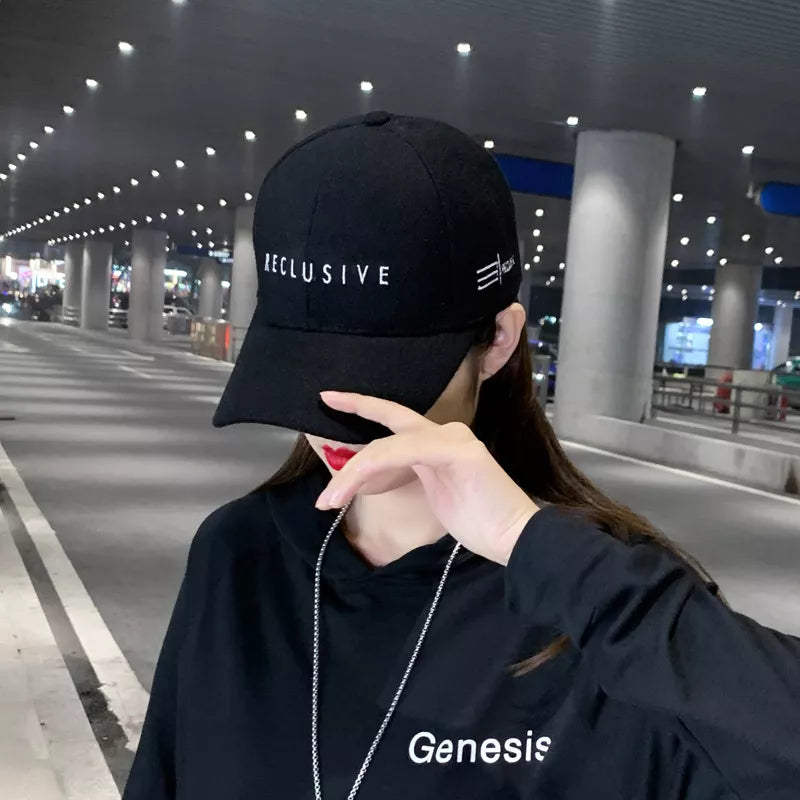 Baseball cap with embroidered lettering side view