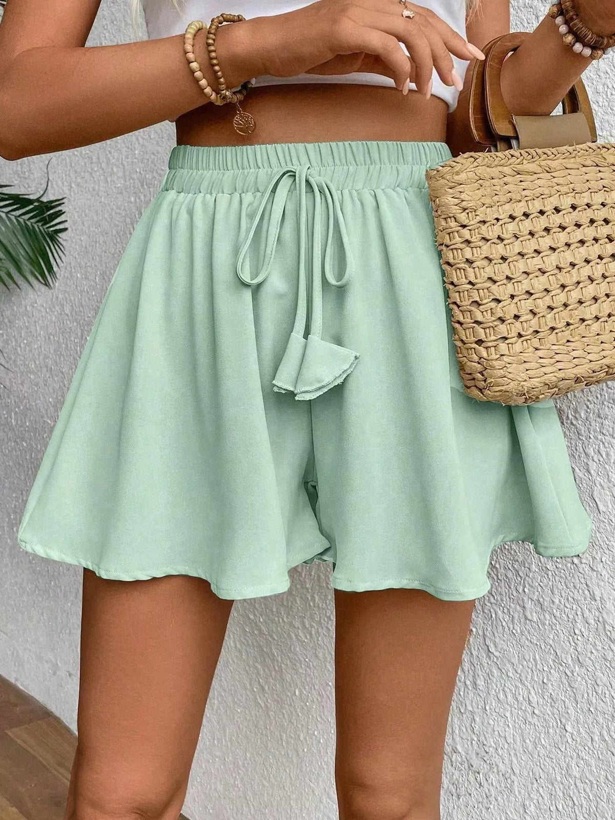 Flowy drawstring waist shorts, side view