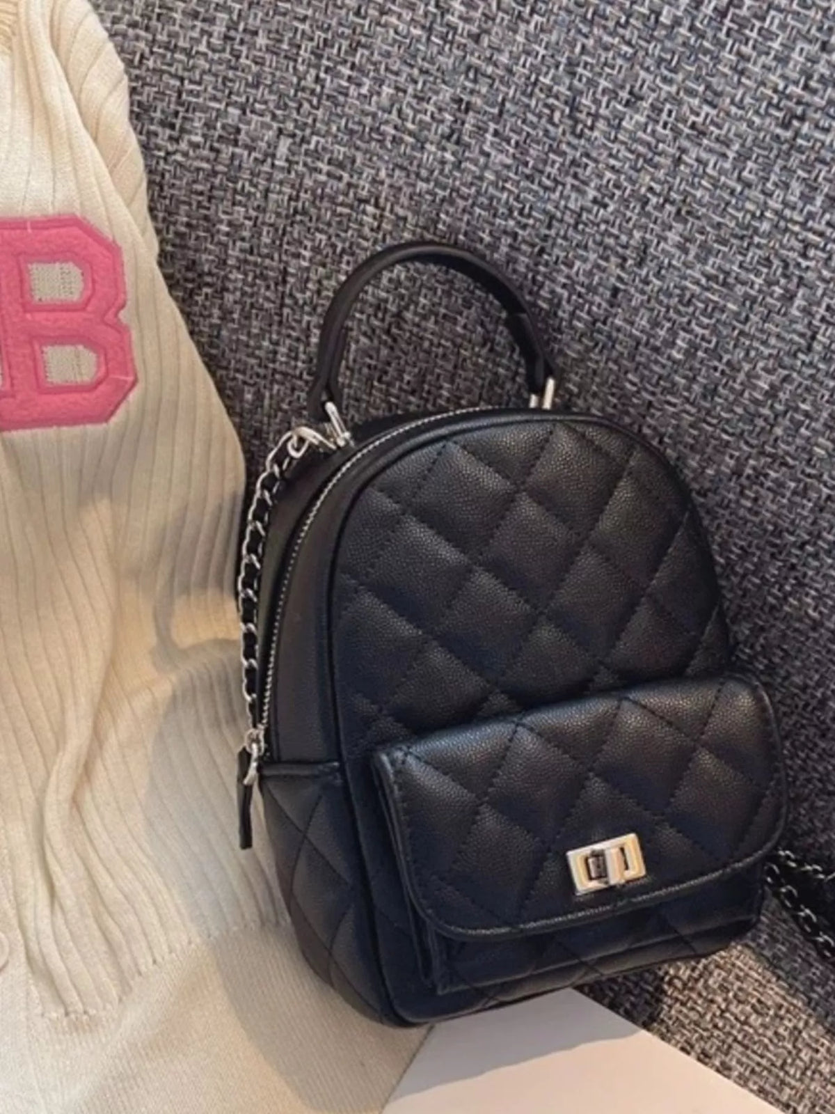 Quilted mini backpack front pocket detail