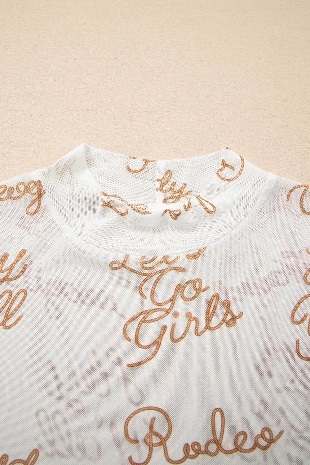 White sheer mesh high neck long sleeve top styled on model