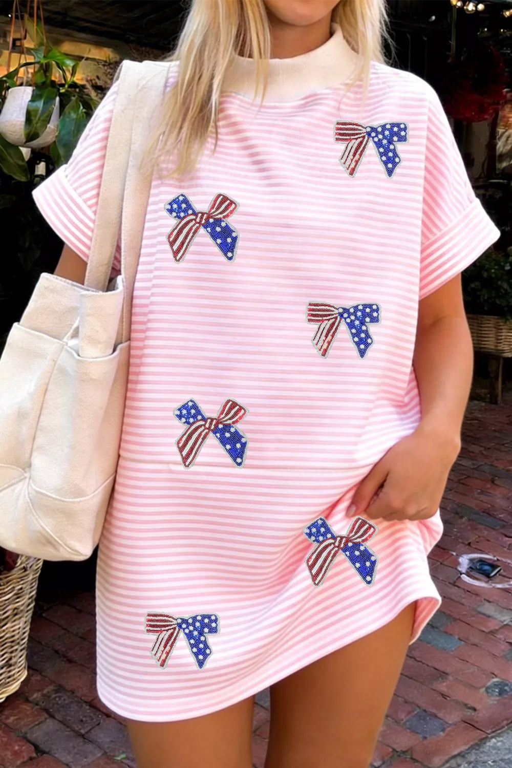Blush pink striped bow sequin mini dress back view