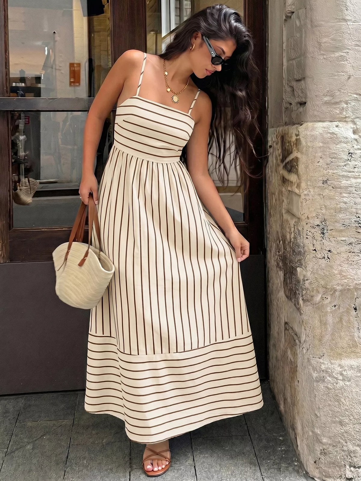 Striped maxi dress side view showing drape