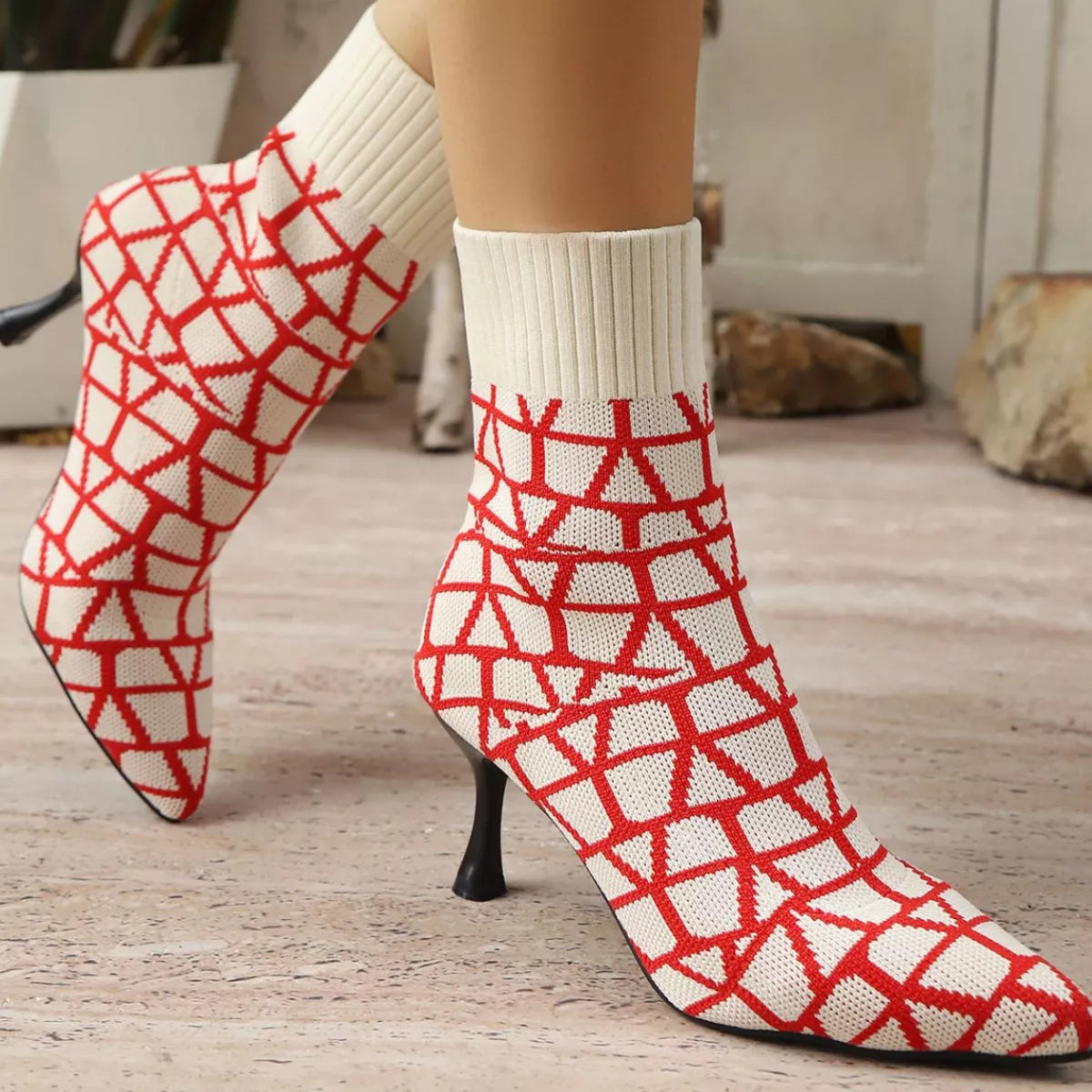 Red point toe flared heel boots top down view