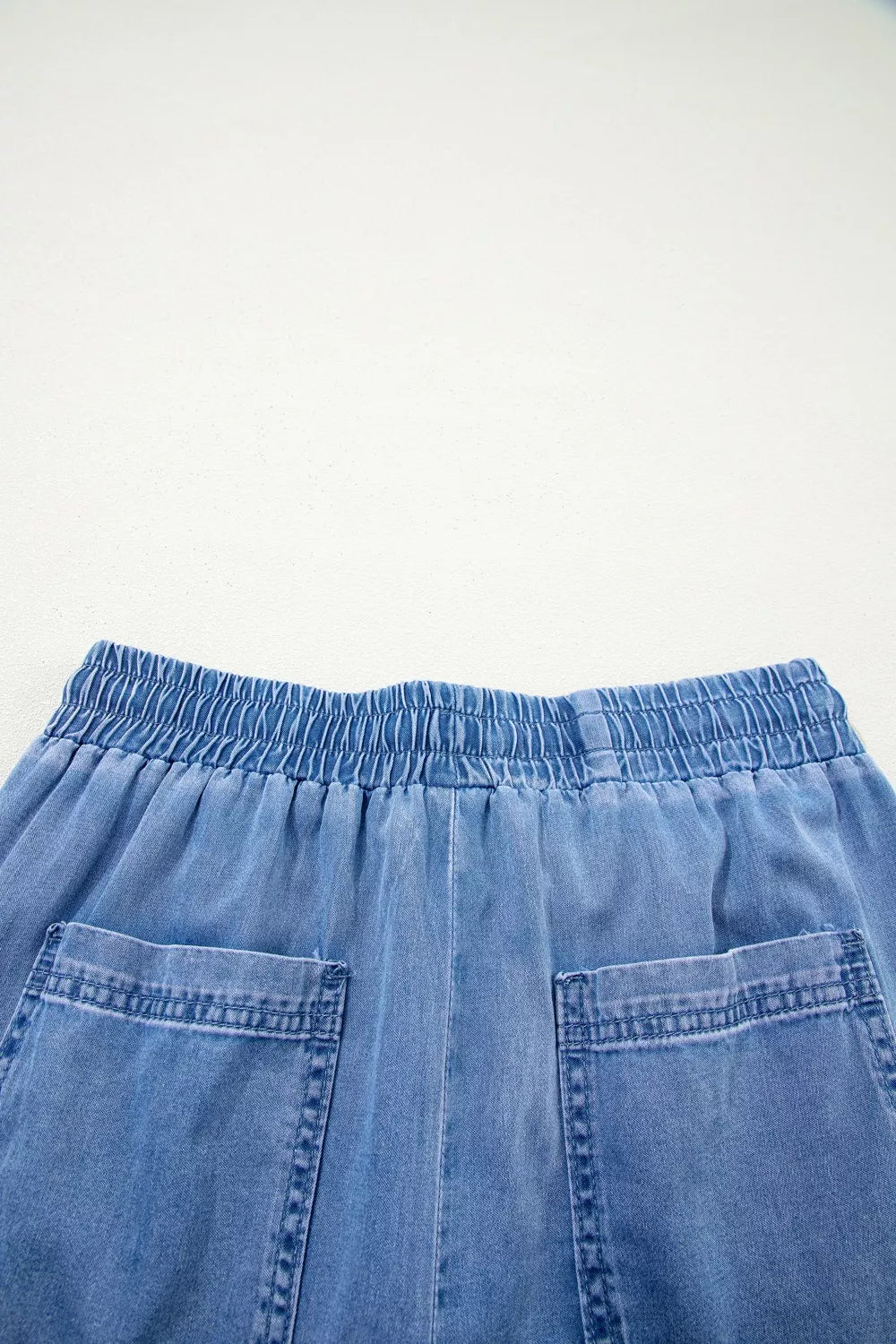 Model wearing light blue loose jeans