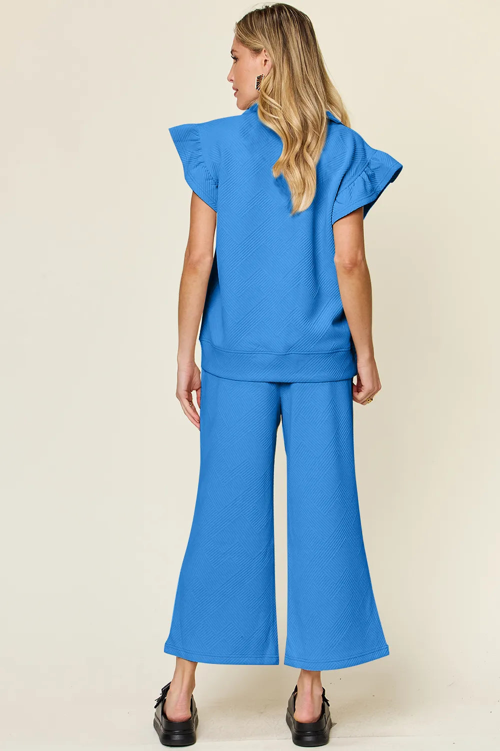 Side view of the two piece wide leg pants set
