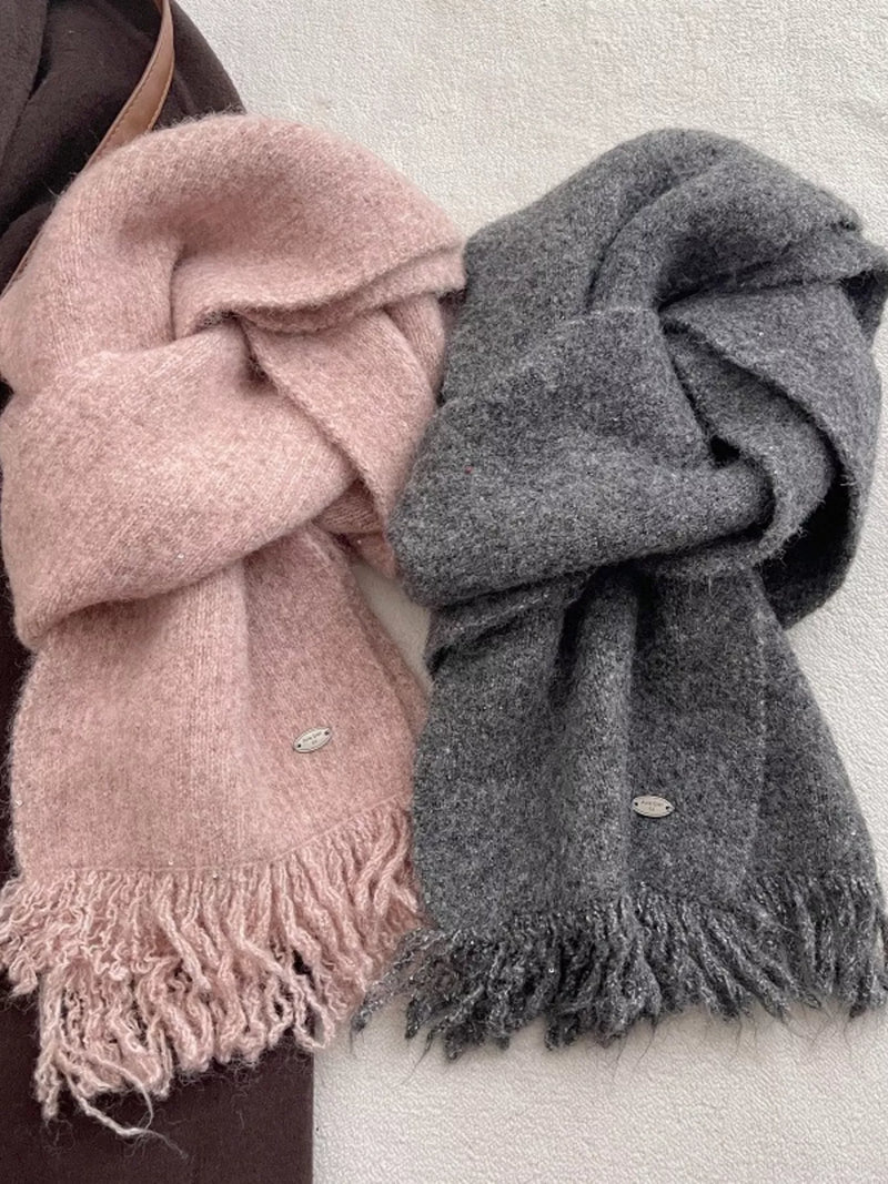 Fringe hem knitted scarf shown in a soft tone