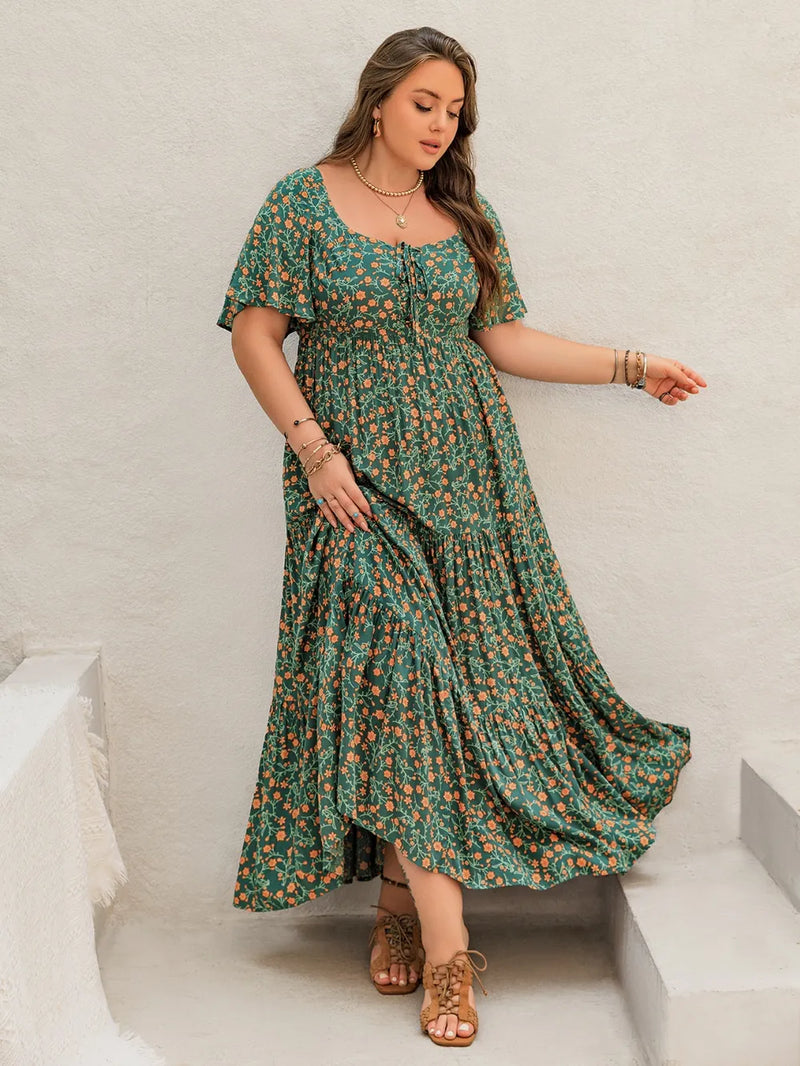 Plus size printed short sleeve tiered maxi dress in dark green front view