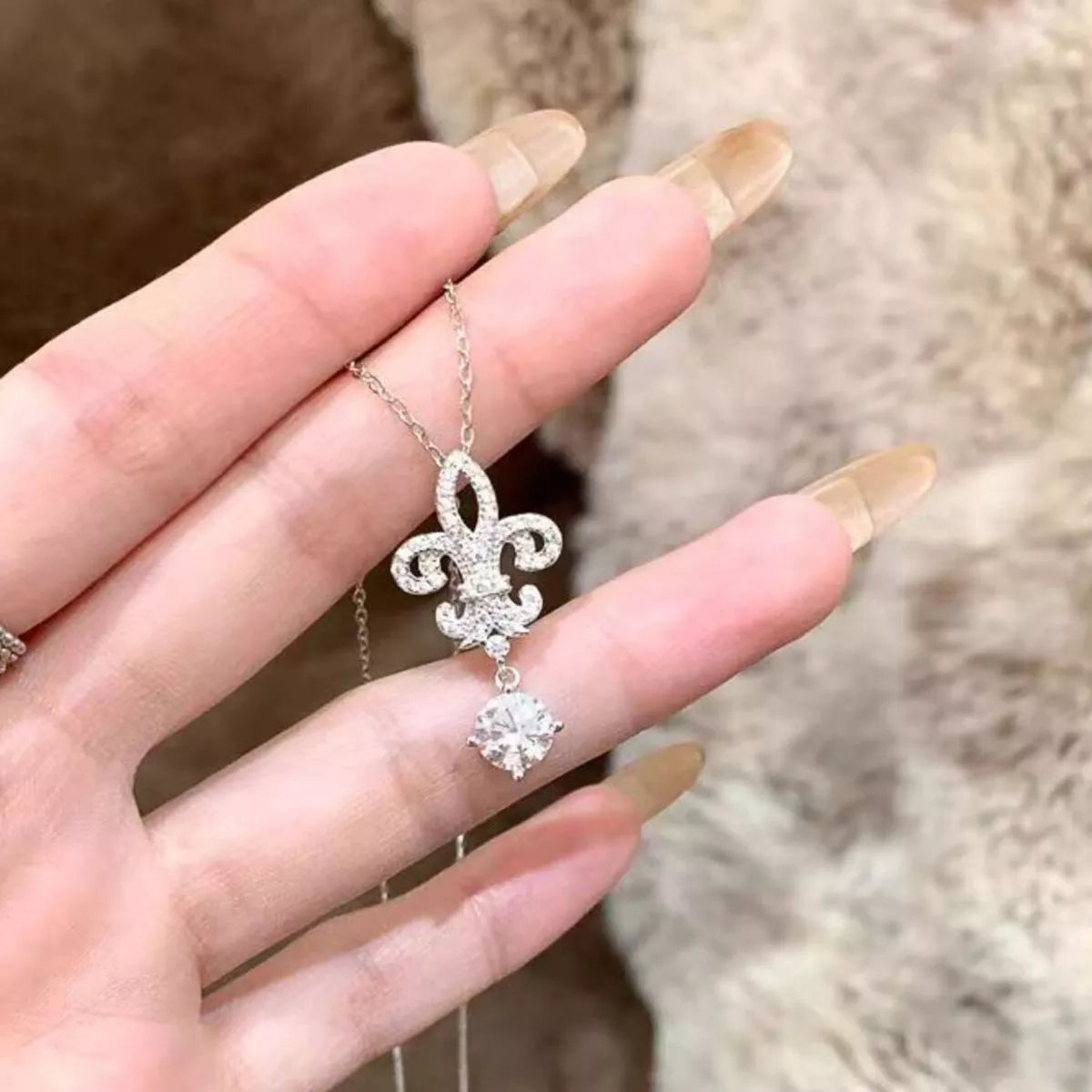 Close up of the moissanite stone set in the silver iris pendant