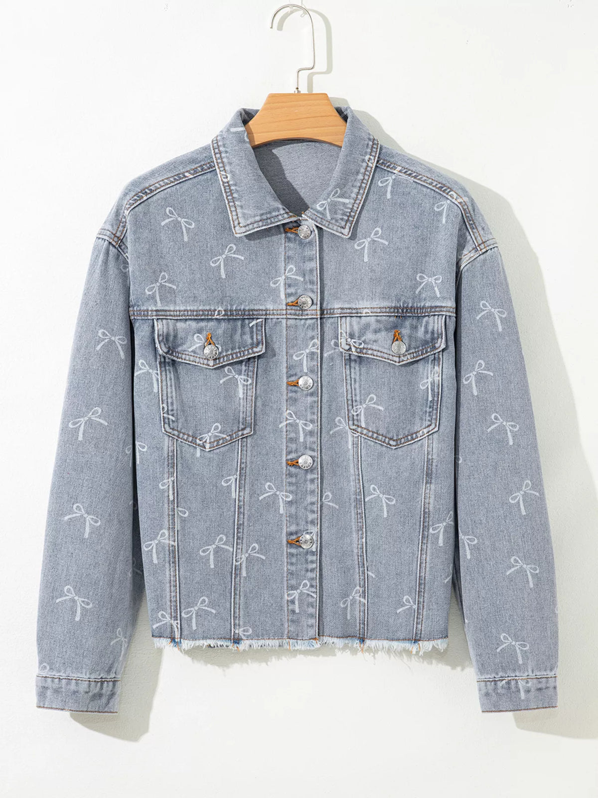 Bow Print Raw Hem Denim Jacket in Light Wash on model
