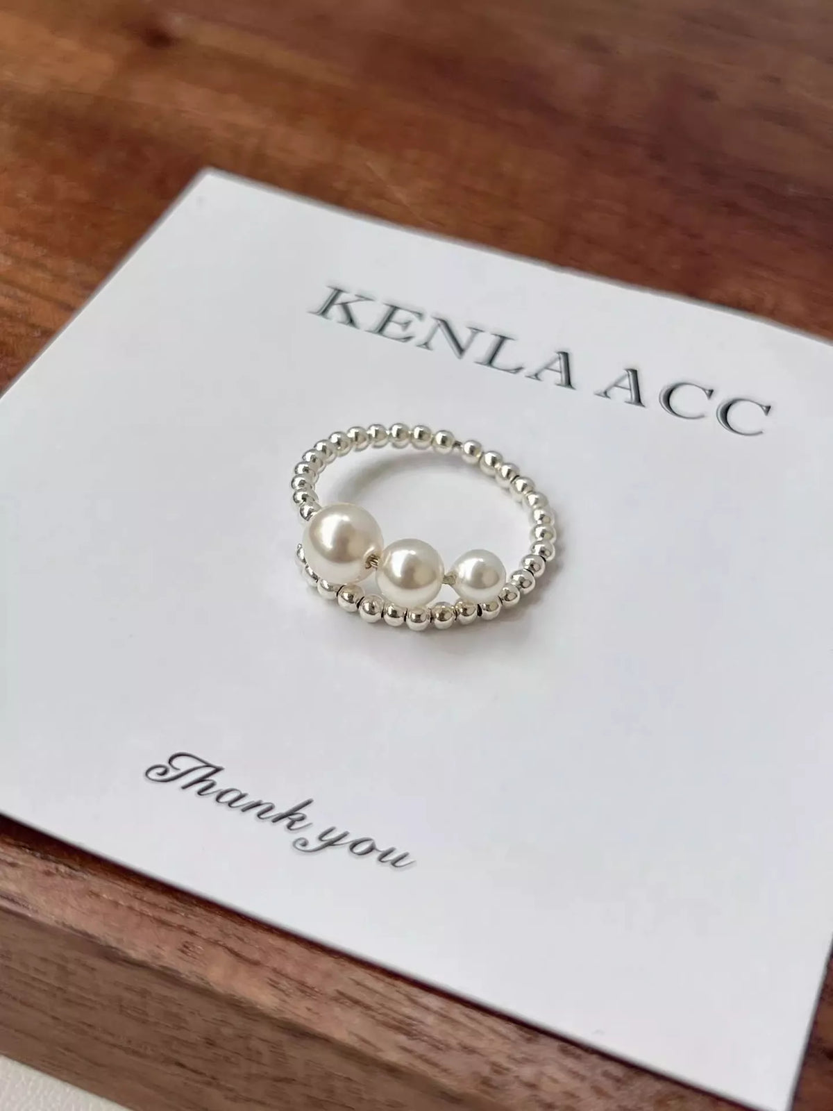 Beaded bypass ring flat lay