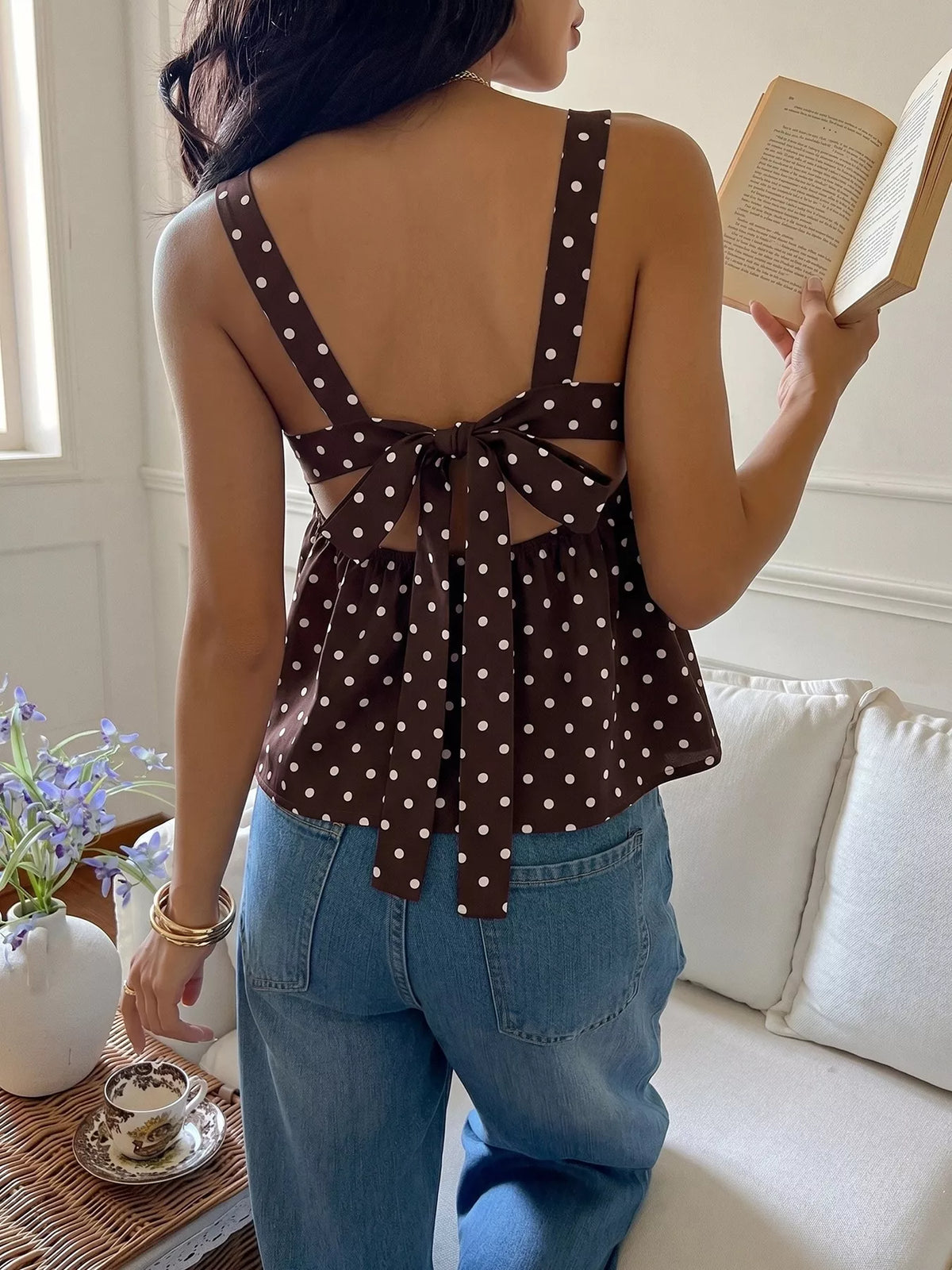 coffee brown polka dot tie back cami top styled on model