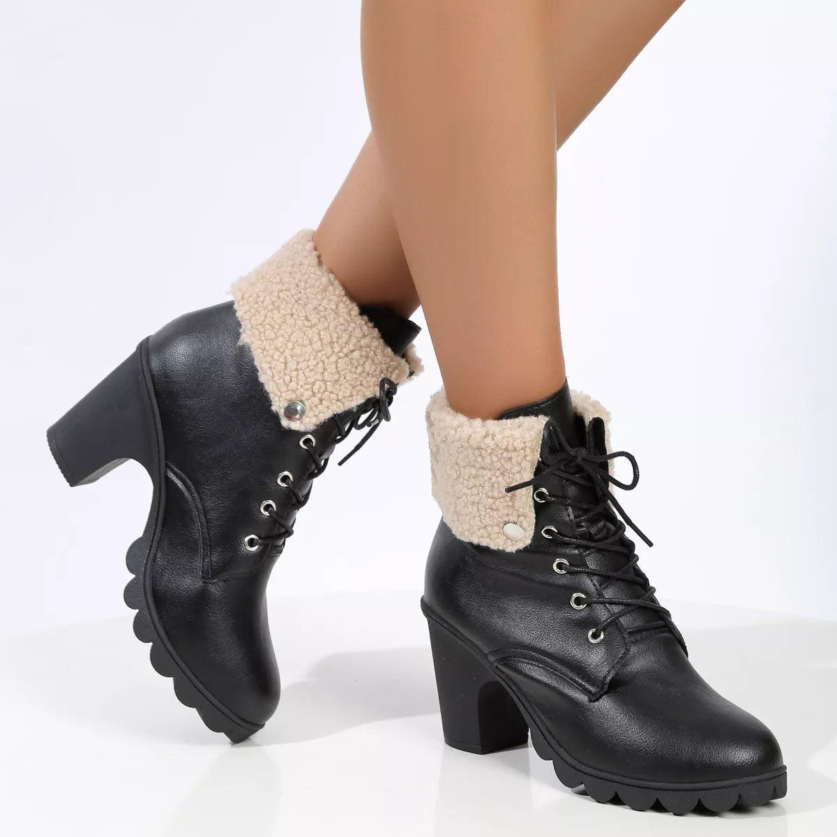 Lace up block heel boots worn with denim